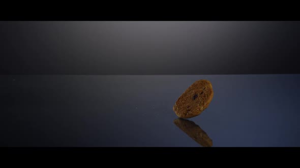 Falling cookies from above onto a reflective surface 