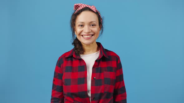 Happy Charwoman Wearing Protective Rubber Gloves Having Fun Making Eyeglasses with Fingers Smiling