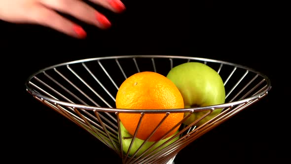 Fruits in Vase, Putting By Two Persons, on Black