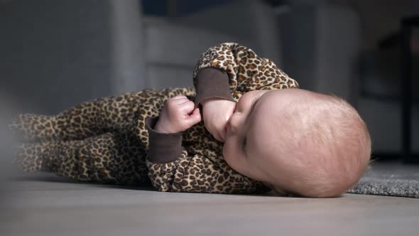 Baby on home floor, shallow depth of field