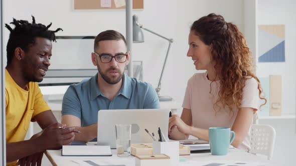 Three Business Colleagues Working Together