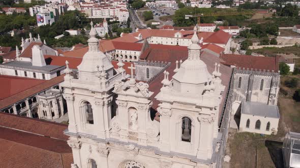 Aerial panning shot capturing the details facade of Monastery of Alcobaça, Portugal.