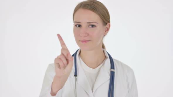 Female Doctor Showing No Sign By Finger on White Background