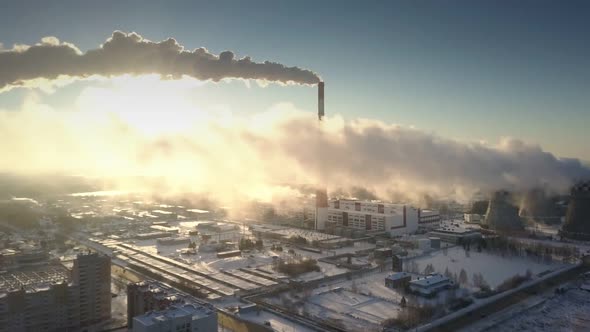 Bird Eye View Gray Smoke Blown From Pipe By Wind at Sunrise