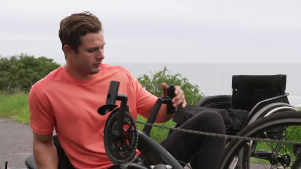 Disabled man tired after riding a recumbent bicycle