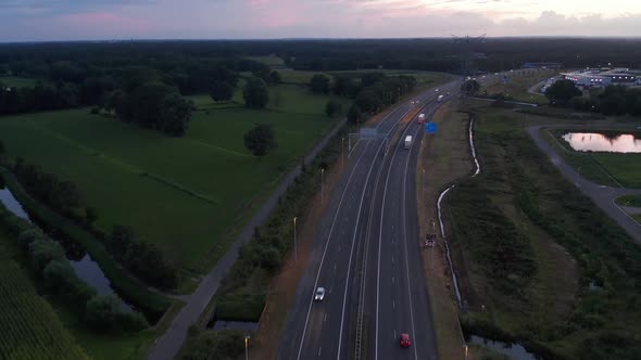 Wide Establisher Over Freeway in Netherlands at Sunset