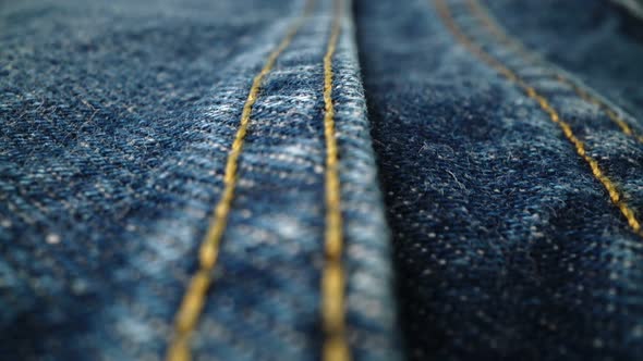 Extreme Detailed of Blue Denim Jeans Texture in Dolly Shot Over Cloth Surface