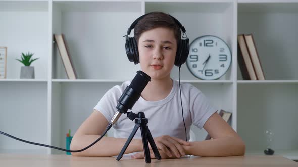 Boy Vlogger Look at Camera and Recording Podcast Video for Internet