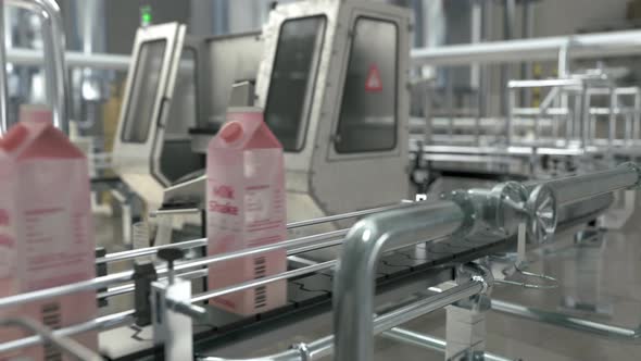 Automated Factory Produces Milk Shake Packs On Conveyor Belt Equipment