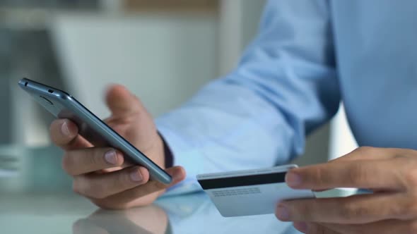 Person Paying Bills From His Mobile Phone, Online Banking Applications, Comfort