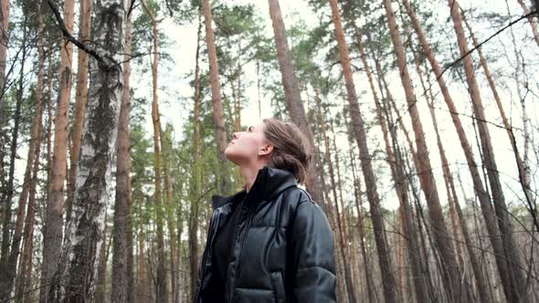 Beautiful woman hiking in the forest