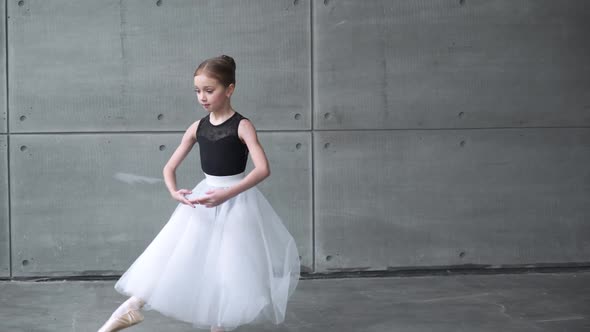 Elegant Little Girl in a Black and White Tutu Dress Dance Ballet and Perform Choreographic Elements