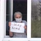 Senior Woman Holds a Poster with the Words Stay Home - VideoHive Item for Sale