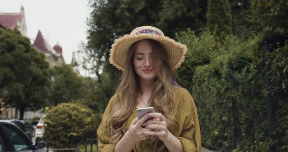 Satisfied Caucasian Young Girl Student Browsing Social Media, Chatting.