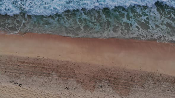 View From Above Stunning Aerial View of Some People Relaxing on a Beautiful Beach Bathed By a