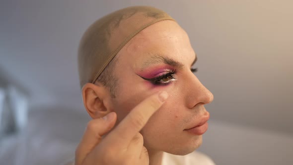 Side View Face Travesty Woman Applying False Eyelashes in Slow Motion