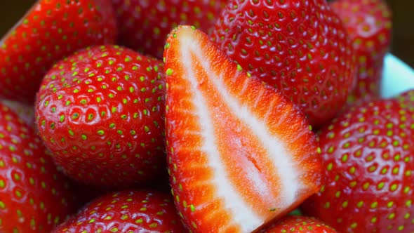 Strawberries close-up, macro. Berries rotate on their axis.