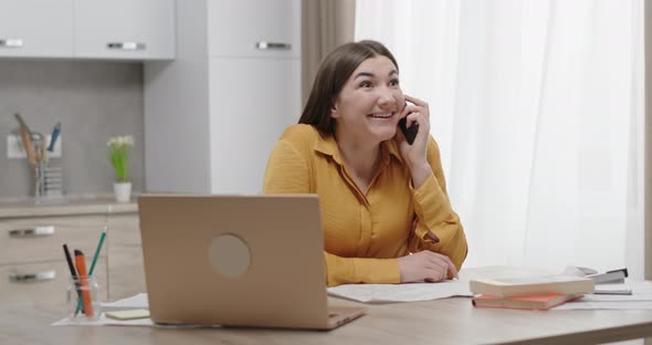 Female Student Speaking on Smartphone with Friend