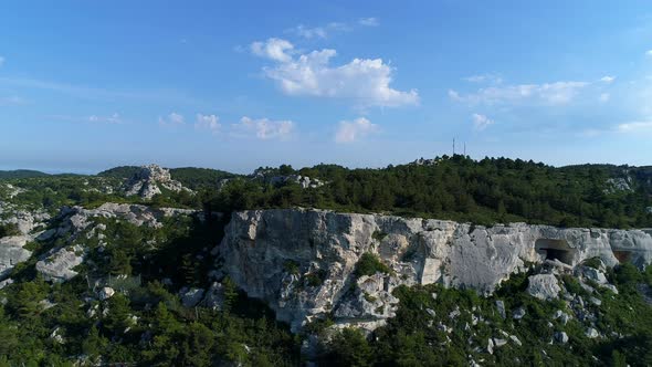 Cave dwellings of the Alpilles massif in France seen from the sky