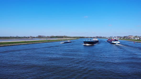 Shipping Vessels Meet At Noord River Loaded With Goods Near Hendrik-Ido-Ambacht, Netherlands. - aeri