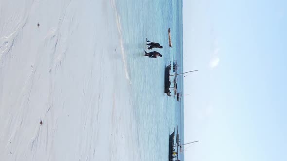 Vertical Video Boats in the Ocean Near the Coast of Zanzibar Tanzania Aerial View