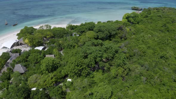 Fishing village and anchored boats on coast of Kwale island, Zanzibar.