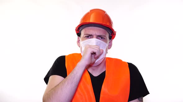 Male Construction Worker in Overalls and Medical Mask Coughing on White Background