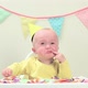 Baby boy sitting in highchair with bunting - VideoHive Item for Sale