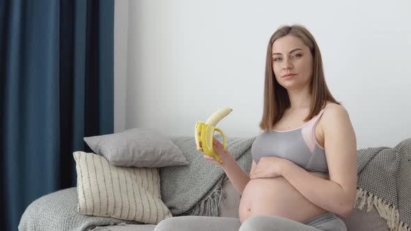 Pregnant Woman Eats Banana and Fruit