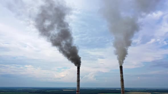 Industrial zone with large smoke from the factory pipes