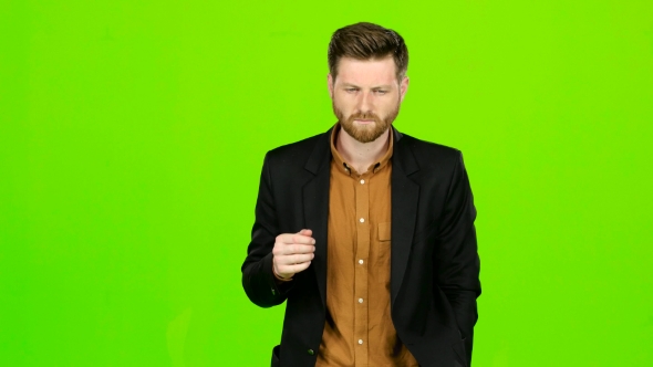 Man Is Suffering, His Head Hurts, He Is Tired. Green Screen