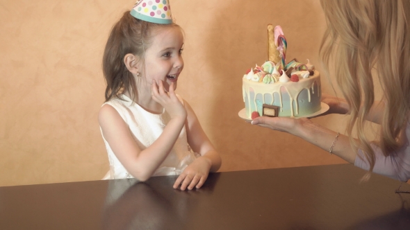 Children's Birthday Party. Birthday Cake for Little Birthday Girl. Family Celebration