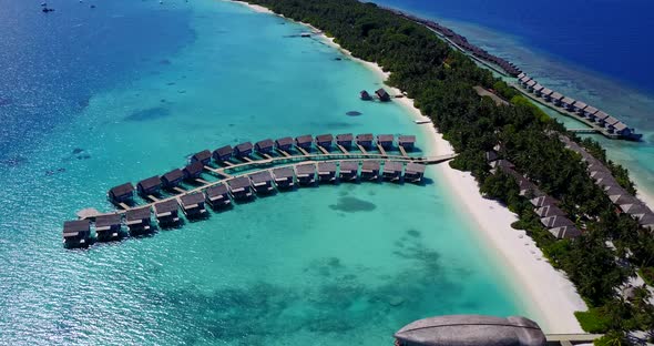 Luxury overhead island view of a sunshine white sandy paradise beach and blue sea background in vibr