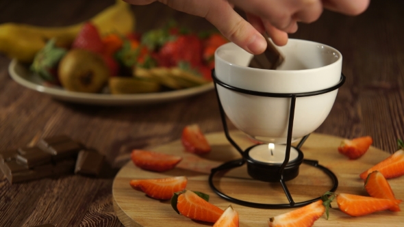 Hands Preparing Chocolate Sauce Fondue