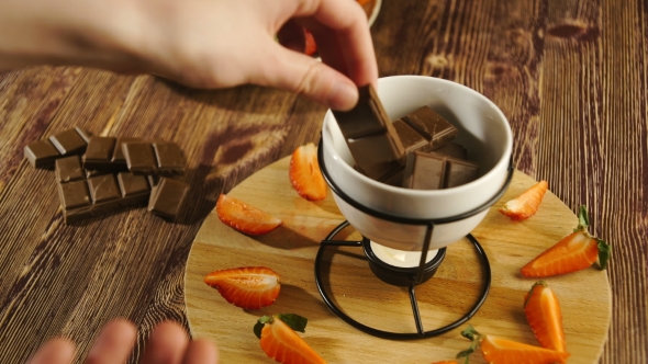 Chocolate Fondue with Fruits Served in a Restaurant