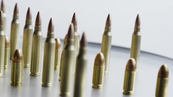 Cinematic rotating shot of bullets on a metallic surface - BULLETS 078