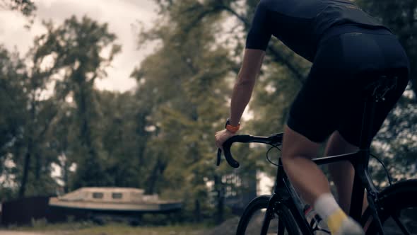 Sport Recreation Bike Cycling On Effort. Peloton Cyclist In Helmet Riding On Sunset.Triathlon Time