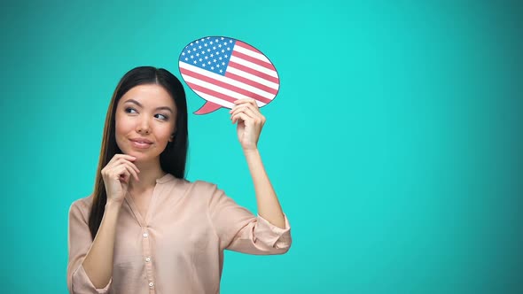Curious Woman Holding USA Flag Sign, Learning Language, Education Abroad