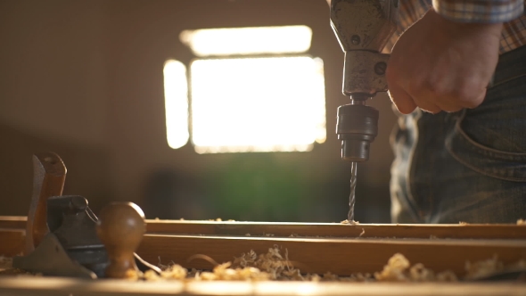 The Carpenter Sweeps the Shavings Off the Wood with Wood