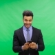 Smiling Businessman Use Cell Smart Phone Over Chroma Key Green Screen Happy Chatting Online - VideoHive Item for Sale