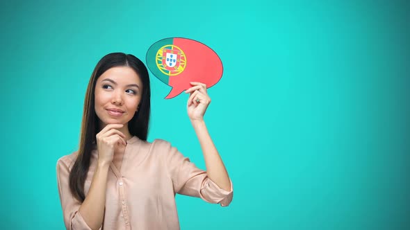 Curious Woman Holding Portuguese Flag Sign, Learning Language, Education Abroad