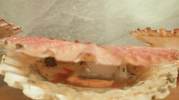 Pink Spotted Shelfish Opens Muscle Slowly Lying on Table