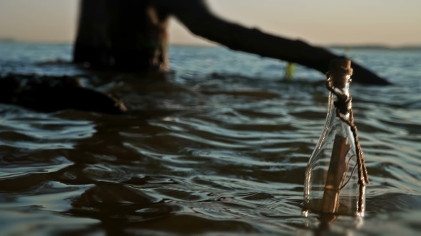 A Bottle with a Note Swings on the Waves