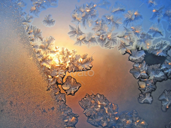 Ice pattern and sunlight on winter glass / Photodune, Misc