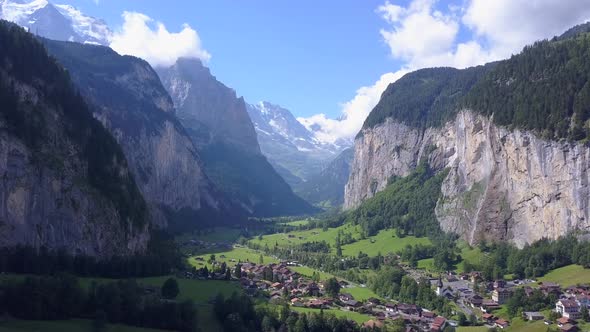 Aerial travel drone view of the Lauterbrunnen Valley and Staubbach Falls, Switzerland.