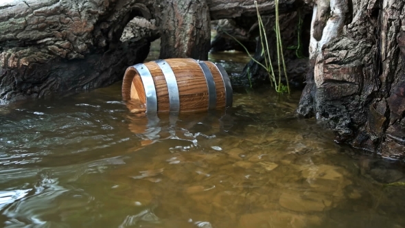 Barrel of Wood Floating on the Waves in the Sea