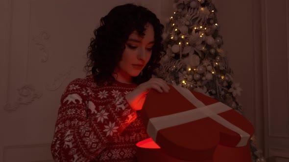 Young Happy Woman Opening Present Box