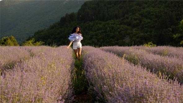 Beautiful Woman Running in Lavender Field