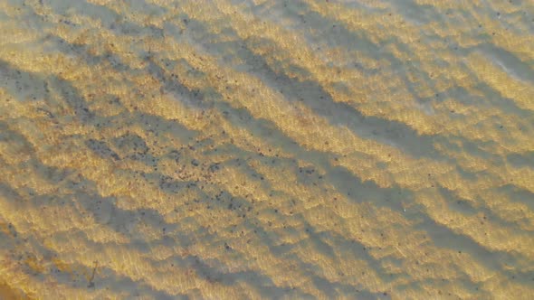 Sand and stones under water