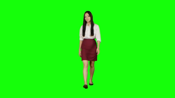 Girl of Asian Appearance Goes To Work and Waves Her Hand. Green Screen